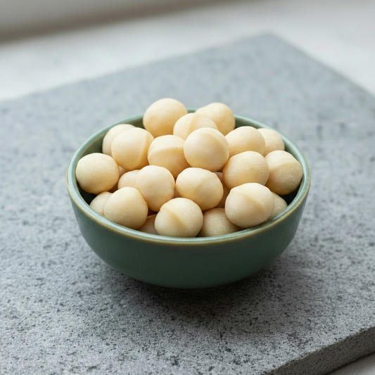 Macadamia Nuts in a ceramic bowl on a stone slab
