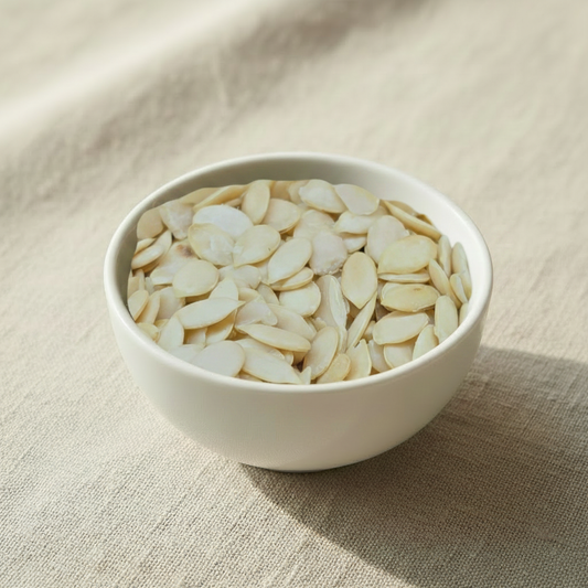 Watermelon Seeds in a ceramic bowl on linen